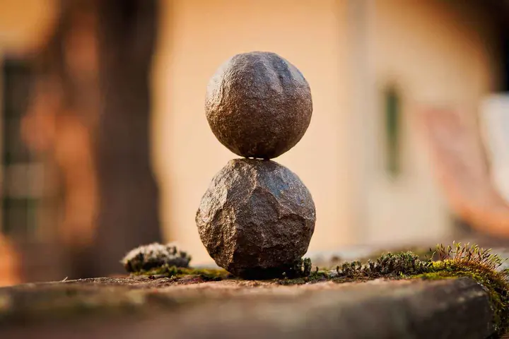 Two round stones balanced on top of each other